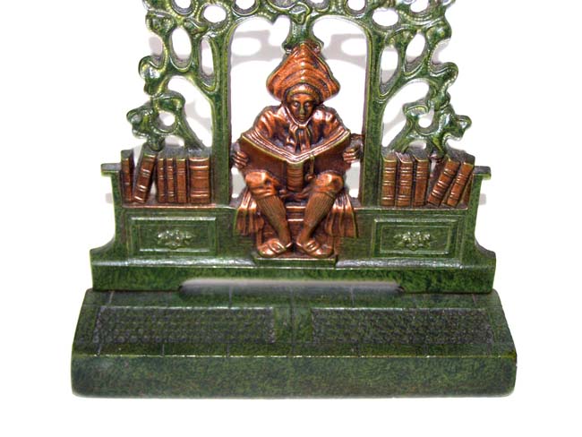 A Beautiful Pair of Antique Bookends circa 1930 depicting a man reading a book under a trellis